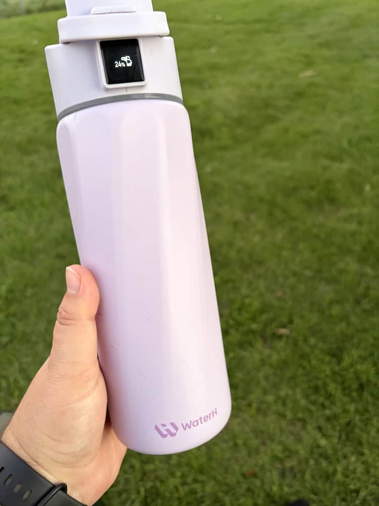 WaterH smart bottle with the percentage display lit up.